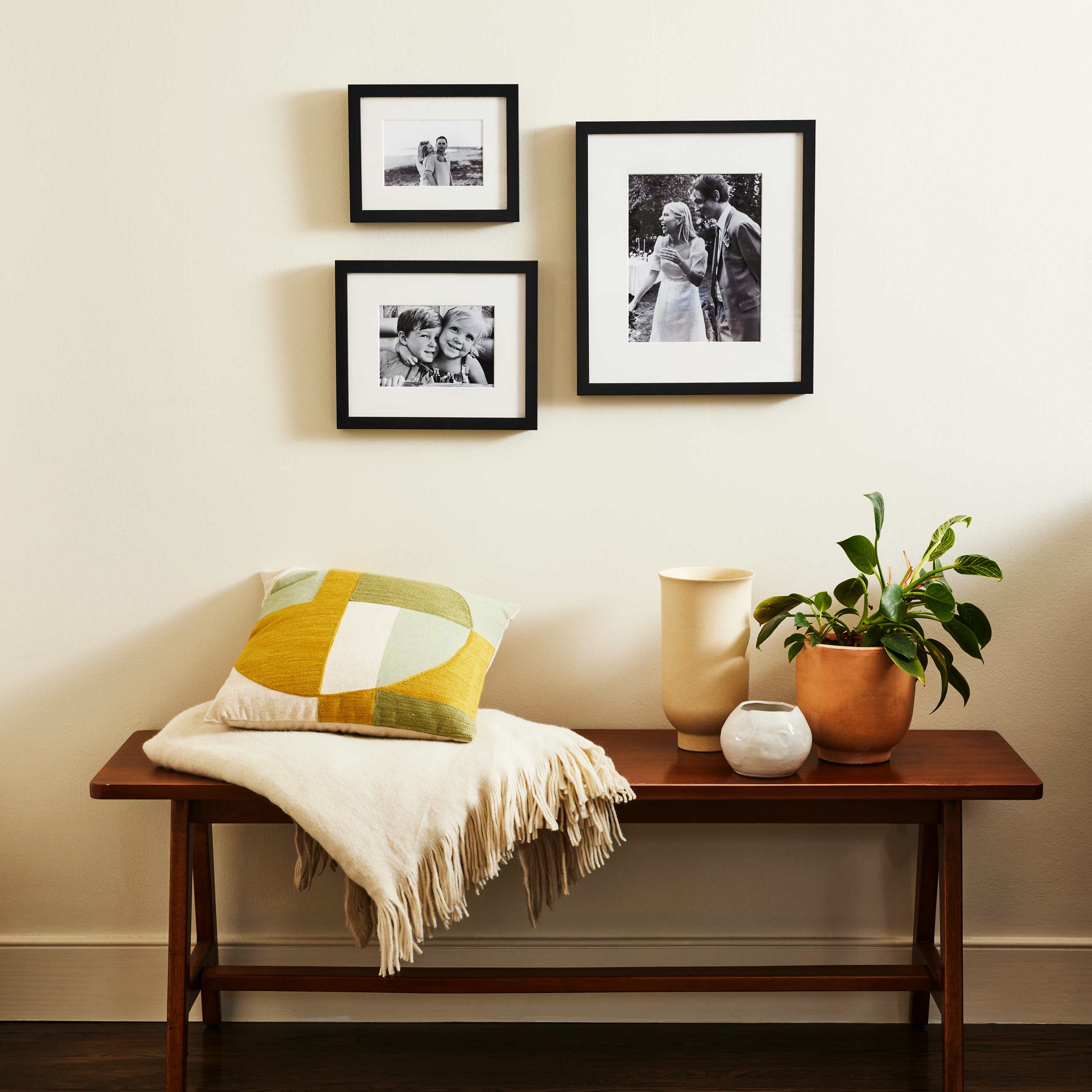 https://www.framebridge.com/cdn/shop/files/GW-SmallSpaceGalleryWall_ProductPhotos_TimelessTrio8.jpg?v=1694635708